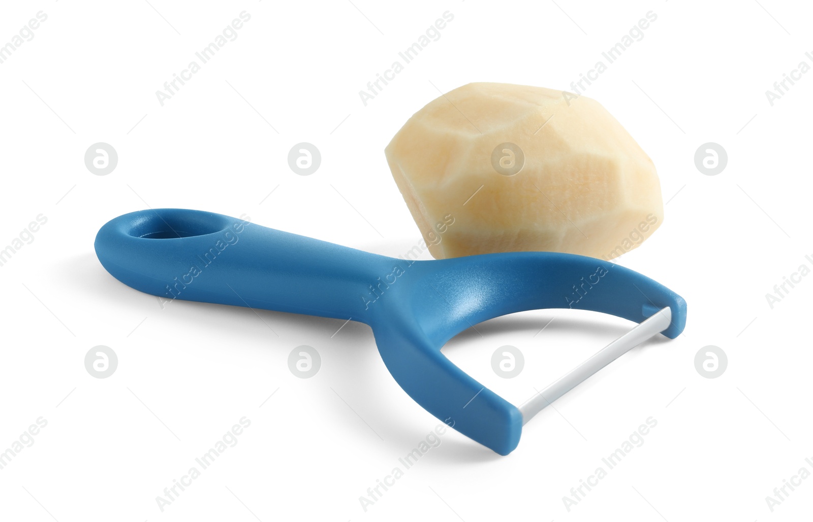 Photo of Fresh raw potato and peeler isolated on white