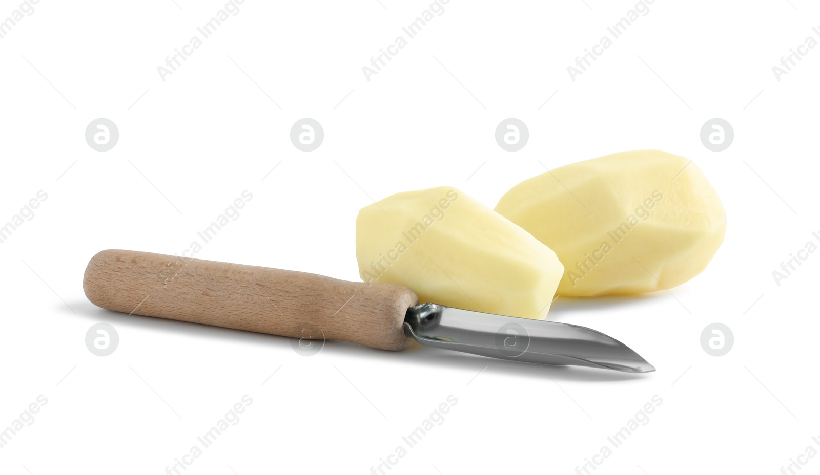 Photo of Fresh raw potatoes and peeler isolated on white