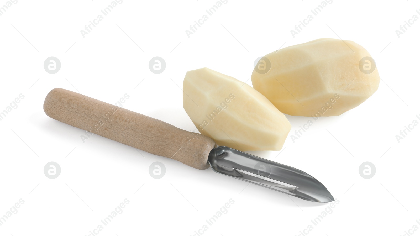 Photo of Fresh raw potatoes and peeler isolated on white