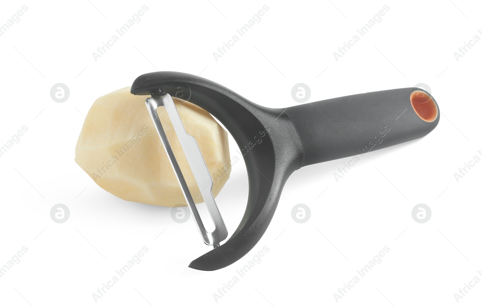 Photo of Fresh raw potato and peeler isolated on white