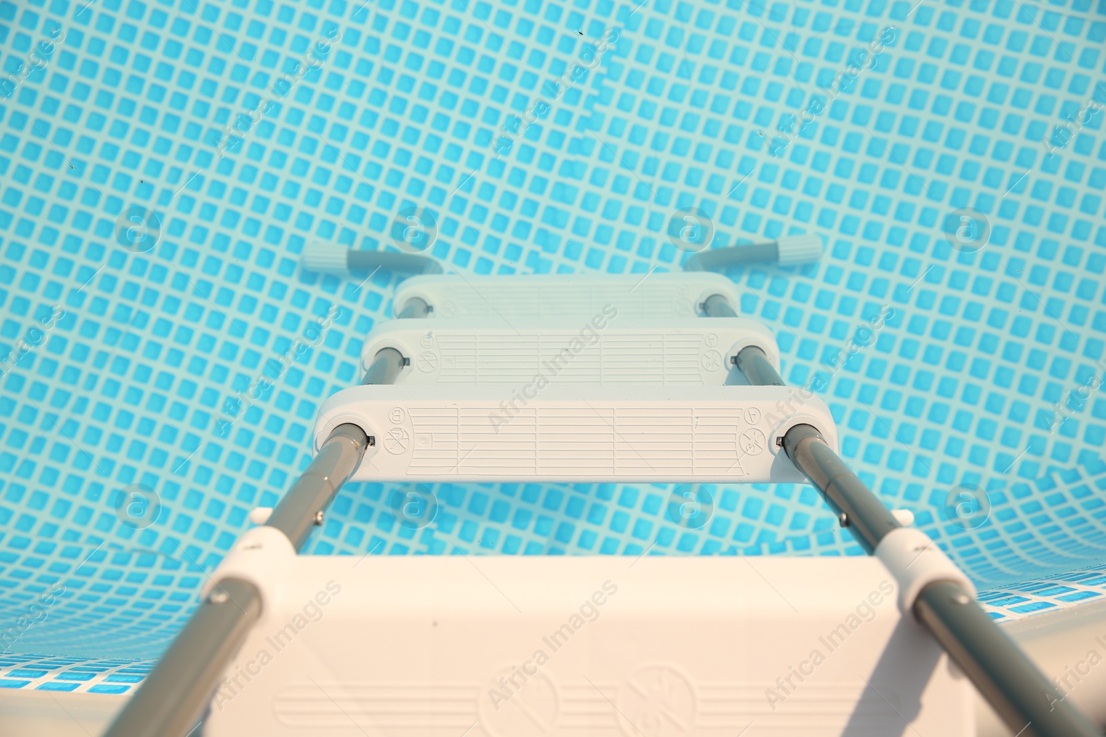 Photo of Ladder and swimming pool outdoors, above view