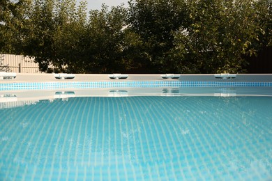 Above ground swimming pool outdoors on sunny day, closeup