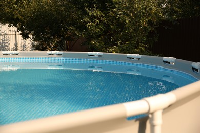 Photo of Above ground swimming pool outdoors on sunny day, closeup