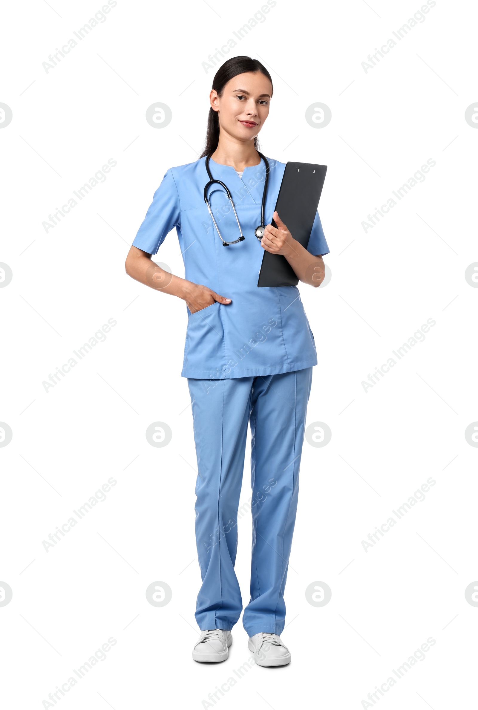 Photo of Beautiful nurse with clipboard on white background