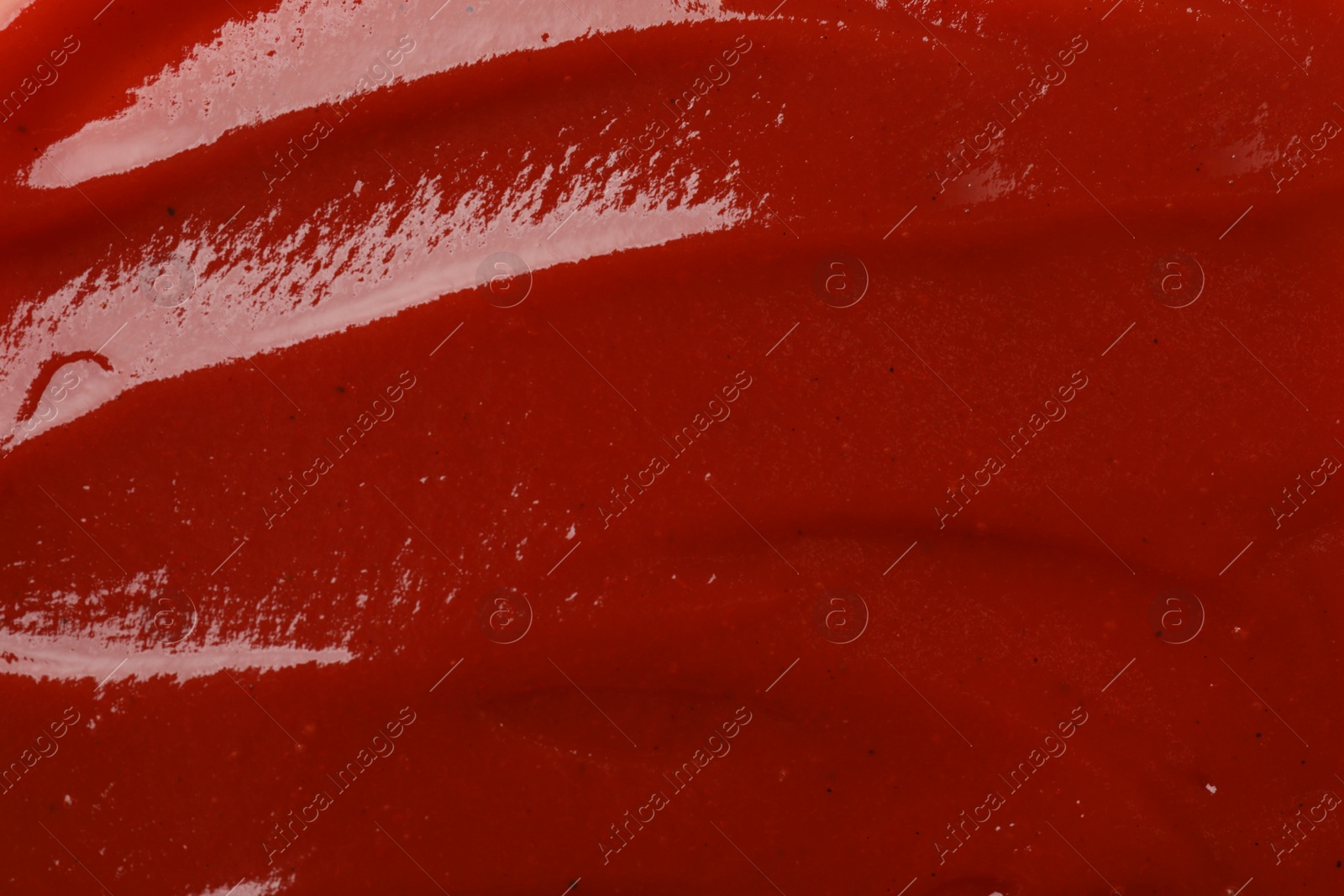 Photo of Texture of tasty ketchup as background, top view. Tomato sauce