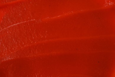 Texture of ketchup as background, top view. Tomato sauce