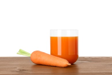 Photo of Fresh carrot juice in glass and vegetable on wooden table against white background