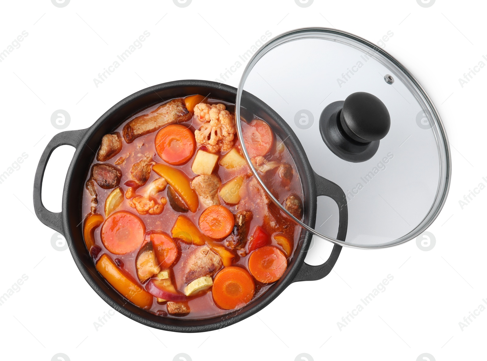 Photo of Tasty homemade stew with vegetables in dish isolated on white, top view