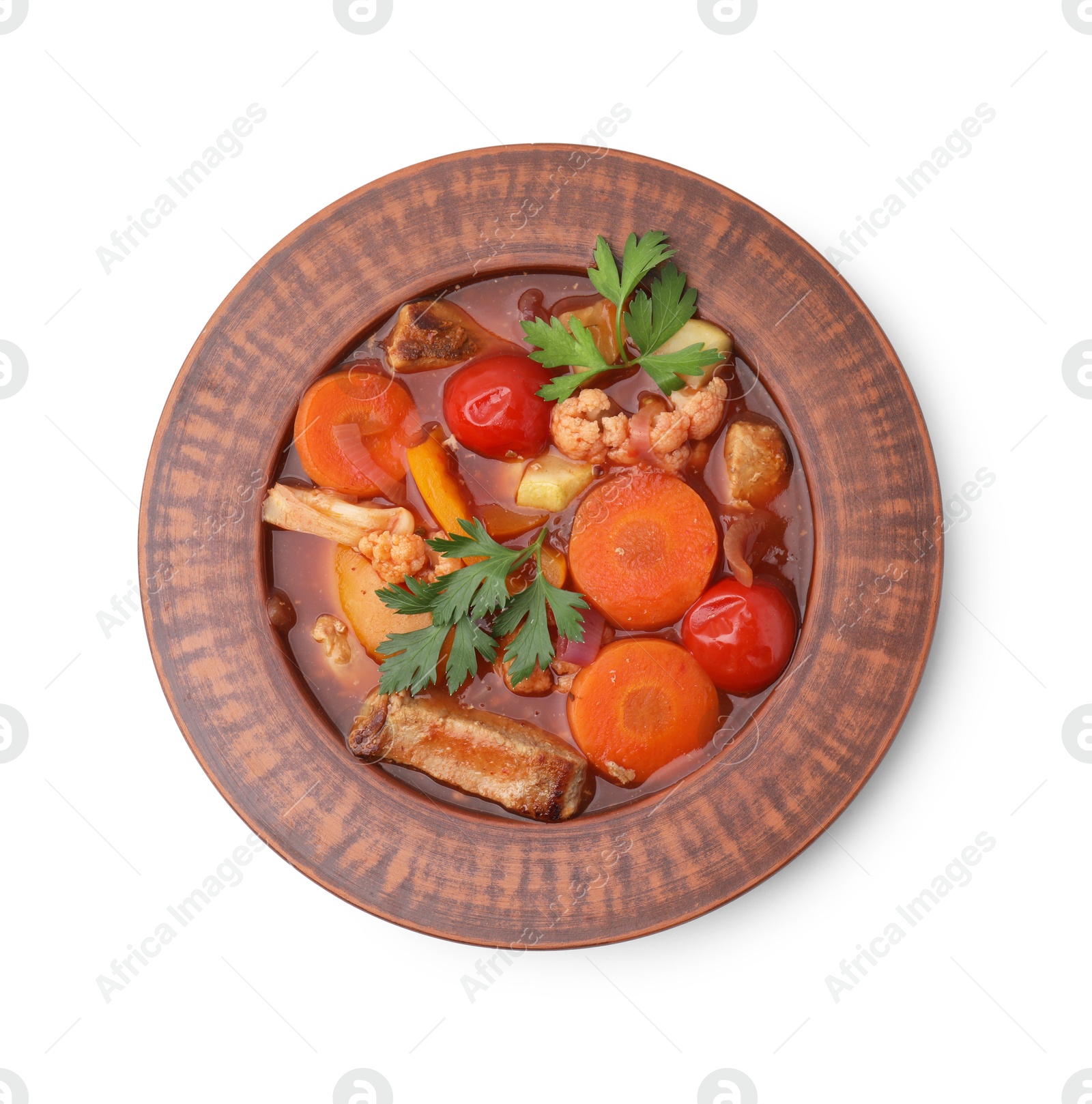 Photo of Tasty homemade stew with vegetables in bowl isolated on white, top view