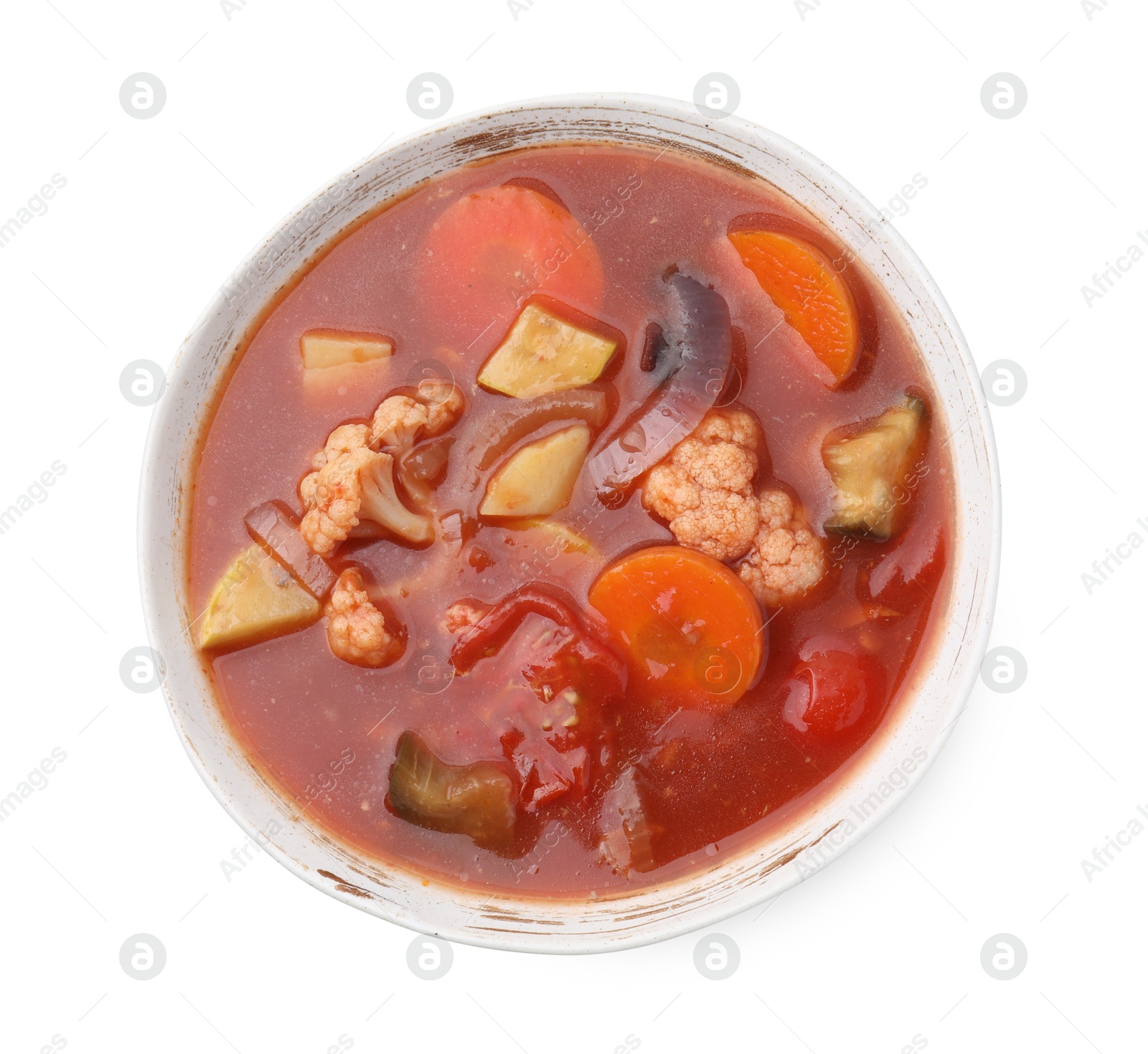 Photo of Delicious homemade stew in bowl isolated on white, top view