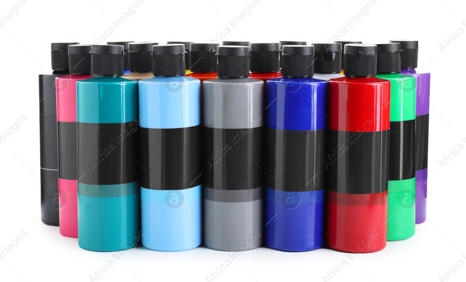 Photo of Acrylic paints of different colors in bottles isolated on white