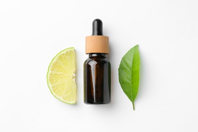 Photo of Bottle of essential oil, lime and green leaf on white background, flat lay