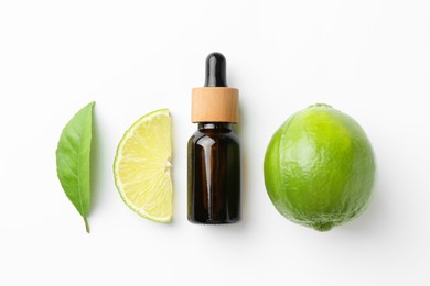 Photo of Bottle of essential oil, lime and green leaf on white background, flat lay