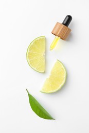 Pipette of essential oil, lime and green leaf on white background, flat lay