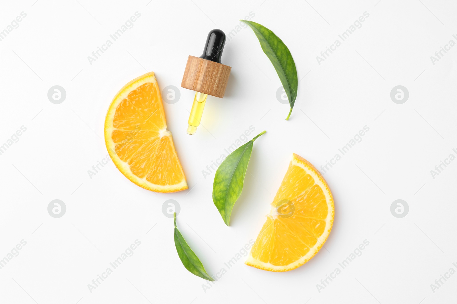 Photo of Dropper of essential oil, orange and green leaves on white background, flat lay