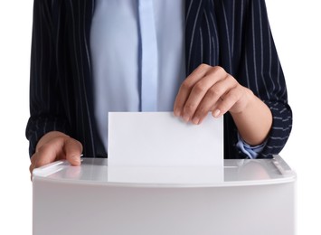 Photo of Woman putting her vote into ballot box against white background, closeup