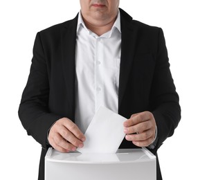 Photo of Man putting his vote into ballot box against white background, closeup