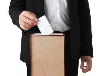 Photo of Man putting his vote into ballot box against white background, closeup