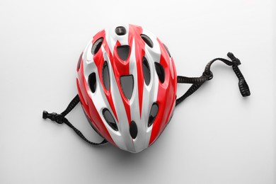 New stylish bicycle helmet on white background, top view