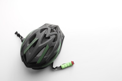 Photo of New stylish bicycle helmet on white background, top view. Space for text