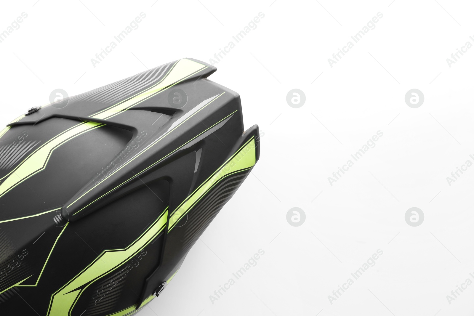 Photo of Stylish motorcycle helmet on white background, top view. Space for text