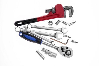 Photo of Set of auto mechanic's tools on white background, flat lay