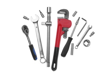 Set of auto mechanic's tools on white background, flat lay