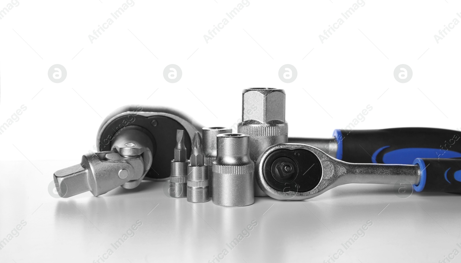 Photo of Set of auto mechanic's tools on white background