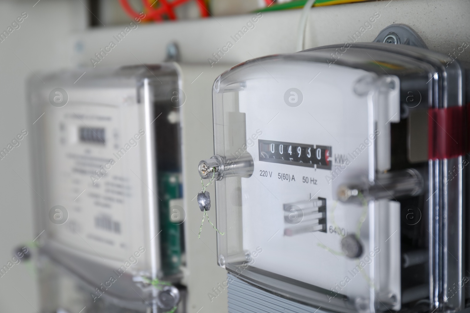 Photo of Electric meters in fuse box, closeup view. Energy measuring device