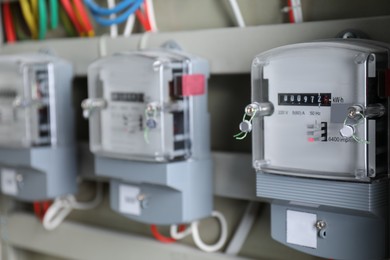 Photo of Electric meters and wires in fuse box. Energy measuring device