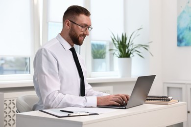 Photo of Man with good posture working in office