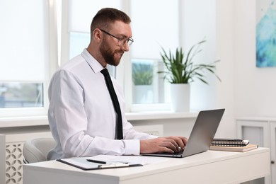 Man with good posture working in office