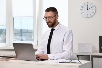 Man with good posture working in office