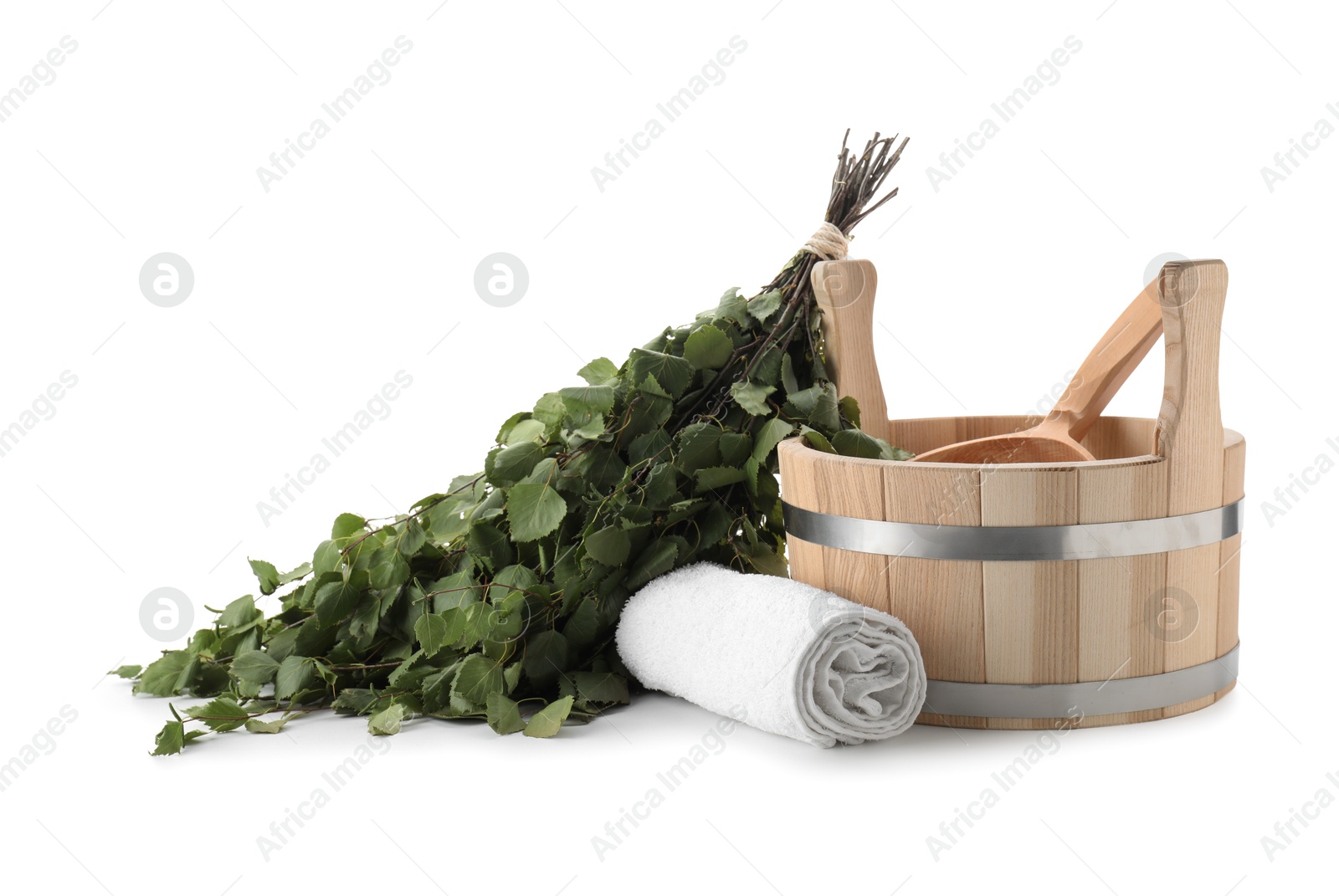 Photo of Sauna equipment. Wooden bucket with ladle, birch whisk and towel isolated on white