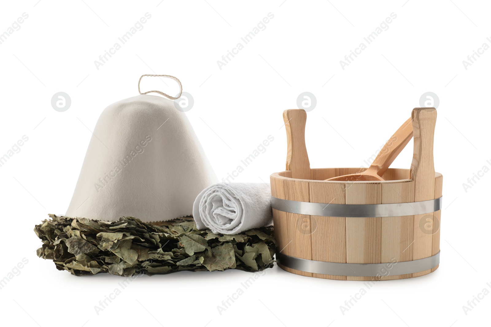 Photo of Sauna equipment. Wooden bucket with ladle, felt wool hat, oak whisk and towel isolated on white