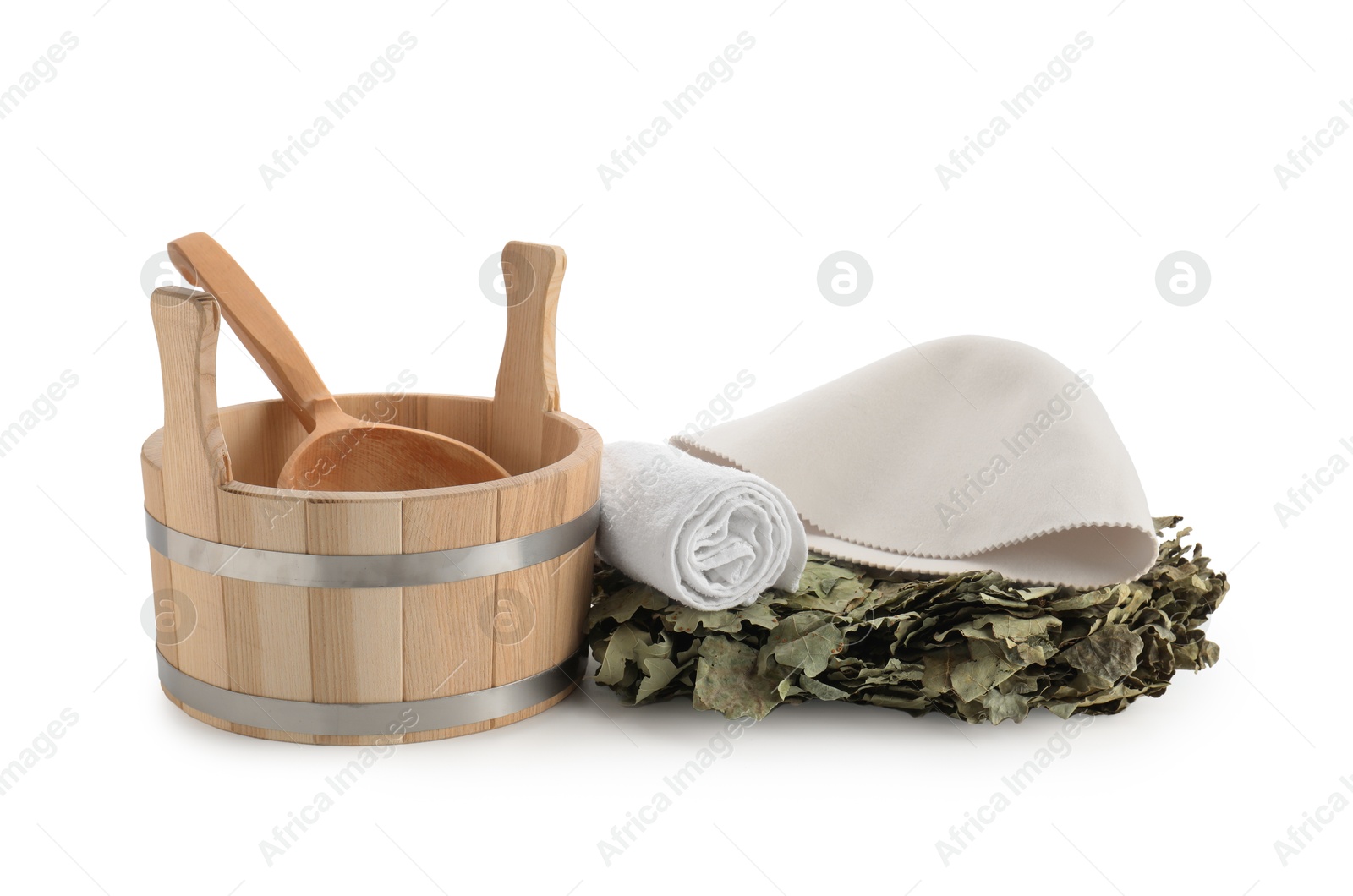 Photo of Sauna equipment. Wooden bucket with ladle, felt wool hat, oak whisk and towel isolated on white