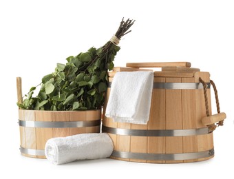 Photo of Sauna equipment. Wooden buckets, birch whisk and towels isolated on white