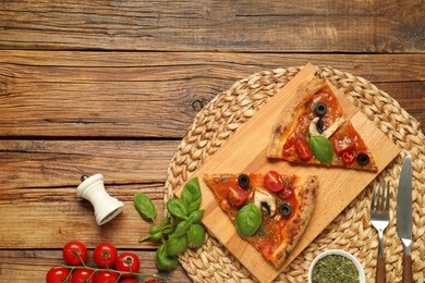 Photo of Flat lay composition of tasty pizza with basil, olives and tomato on wooden table. Space for text