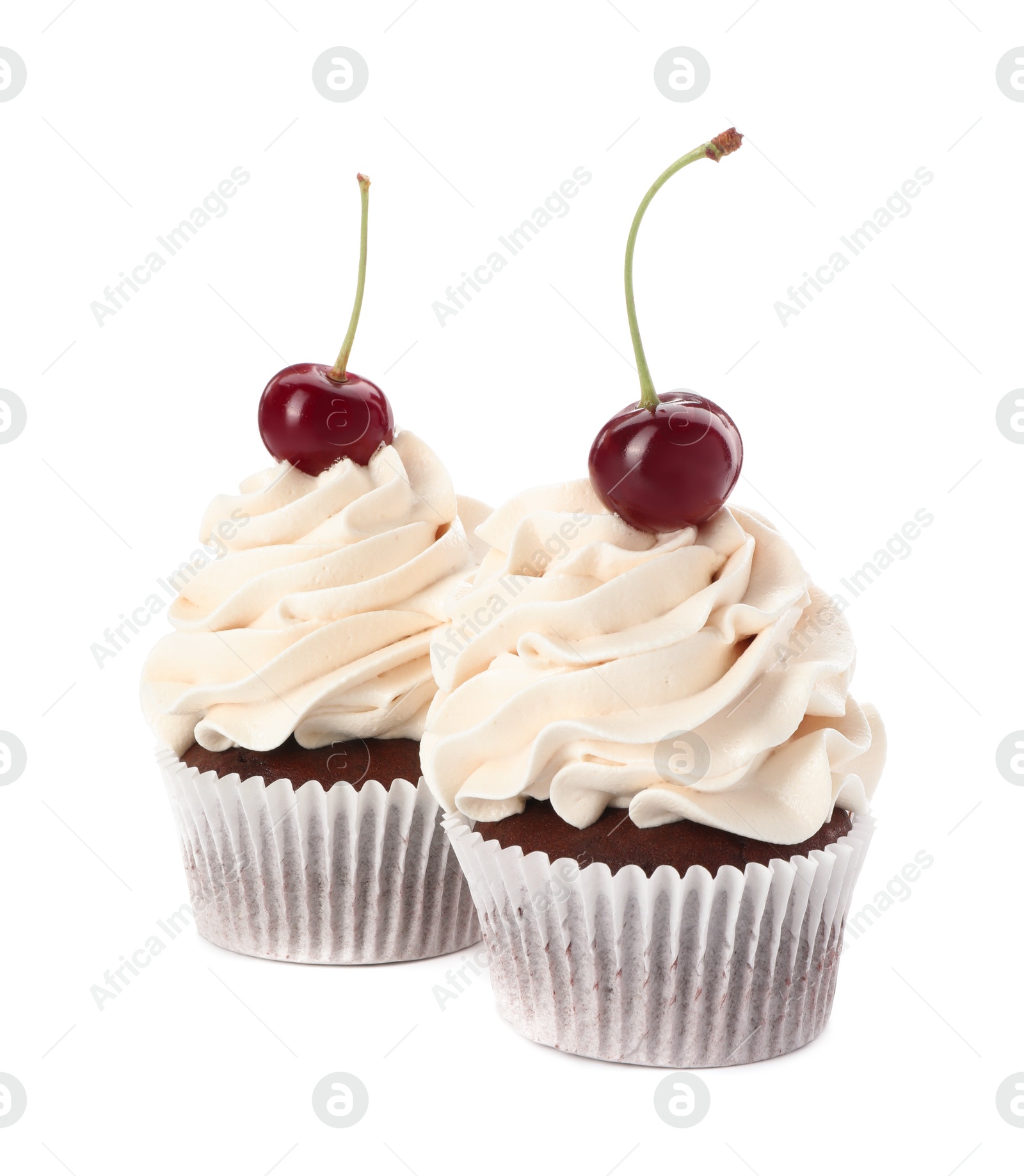 Photo of Delicious cupcakes with cream and cherries isolated on white