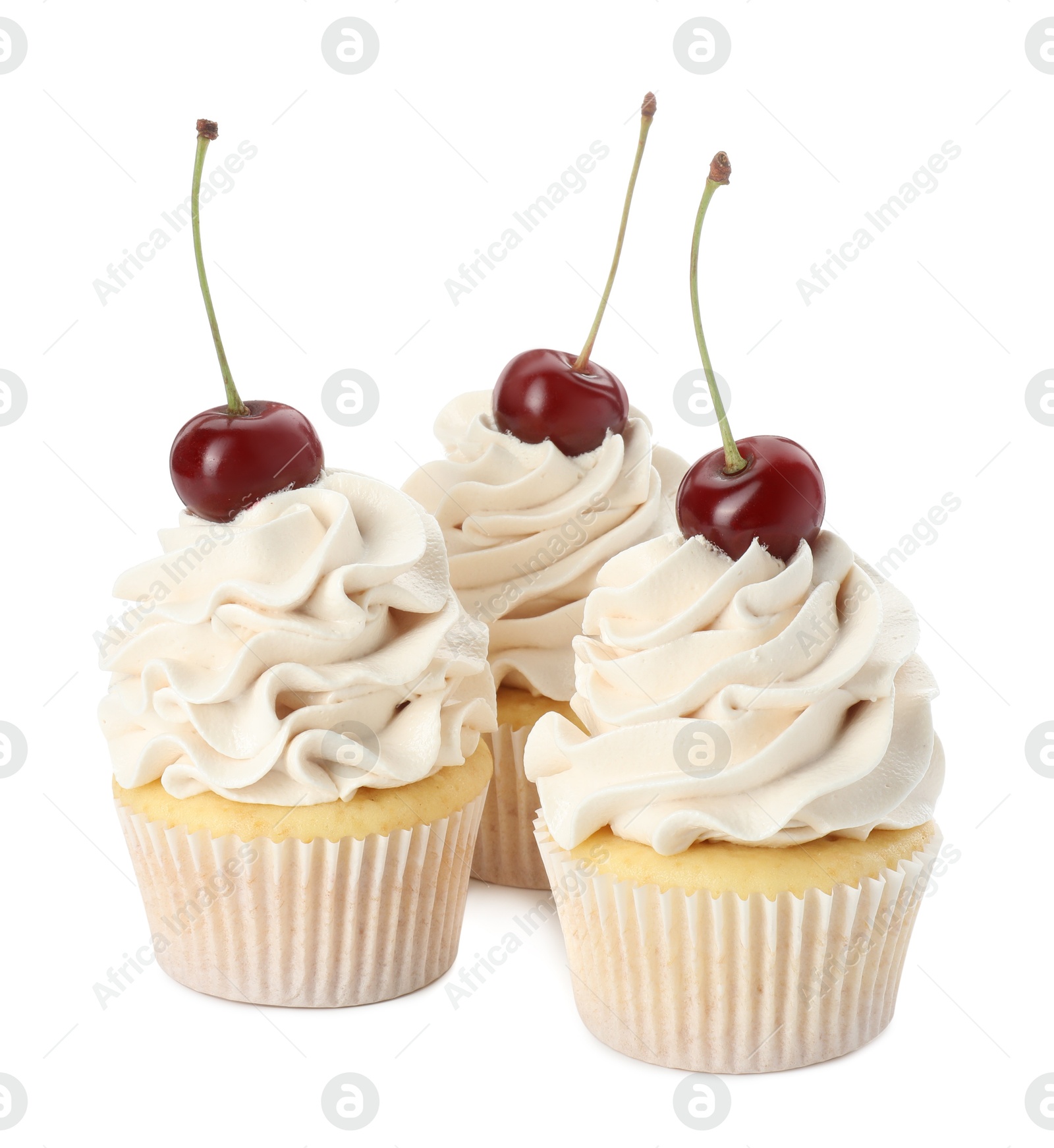 Photo of Delicious cupcakes with cream and cherries isolated on white