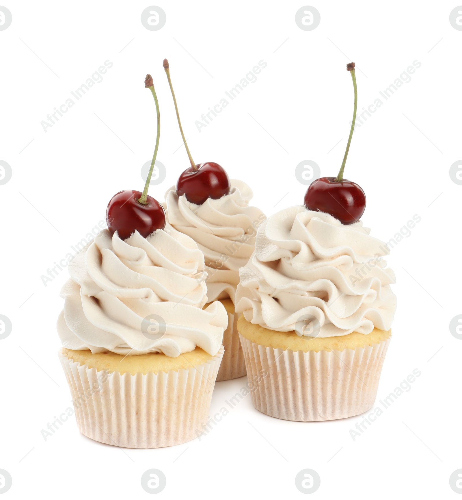 Photo of Delicious cupcakes with cream and cherries isolated on white