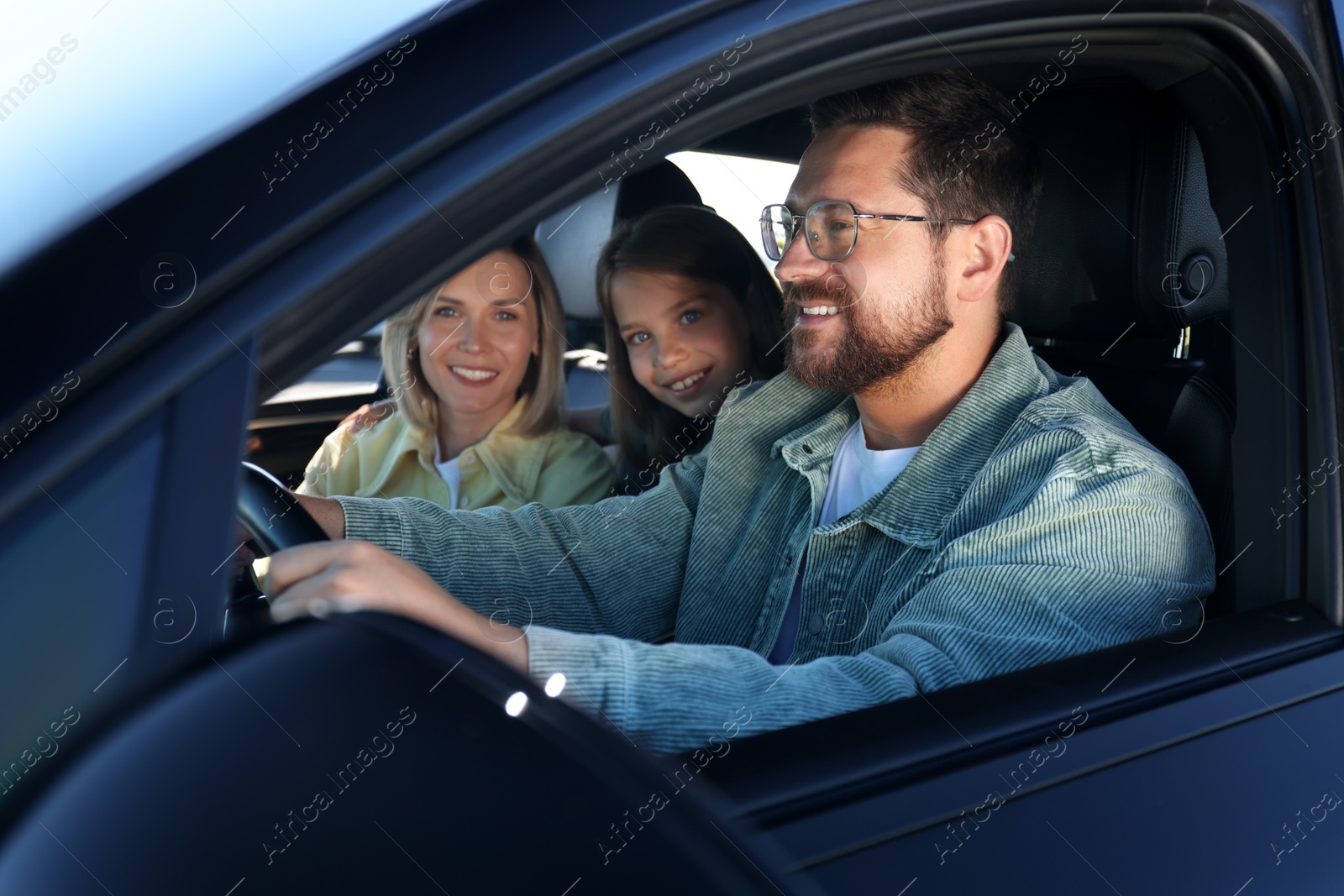 Photo of Happy family enjoying trip together by car, view from outside