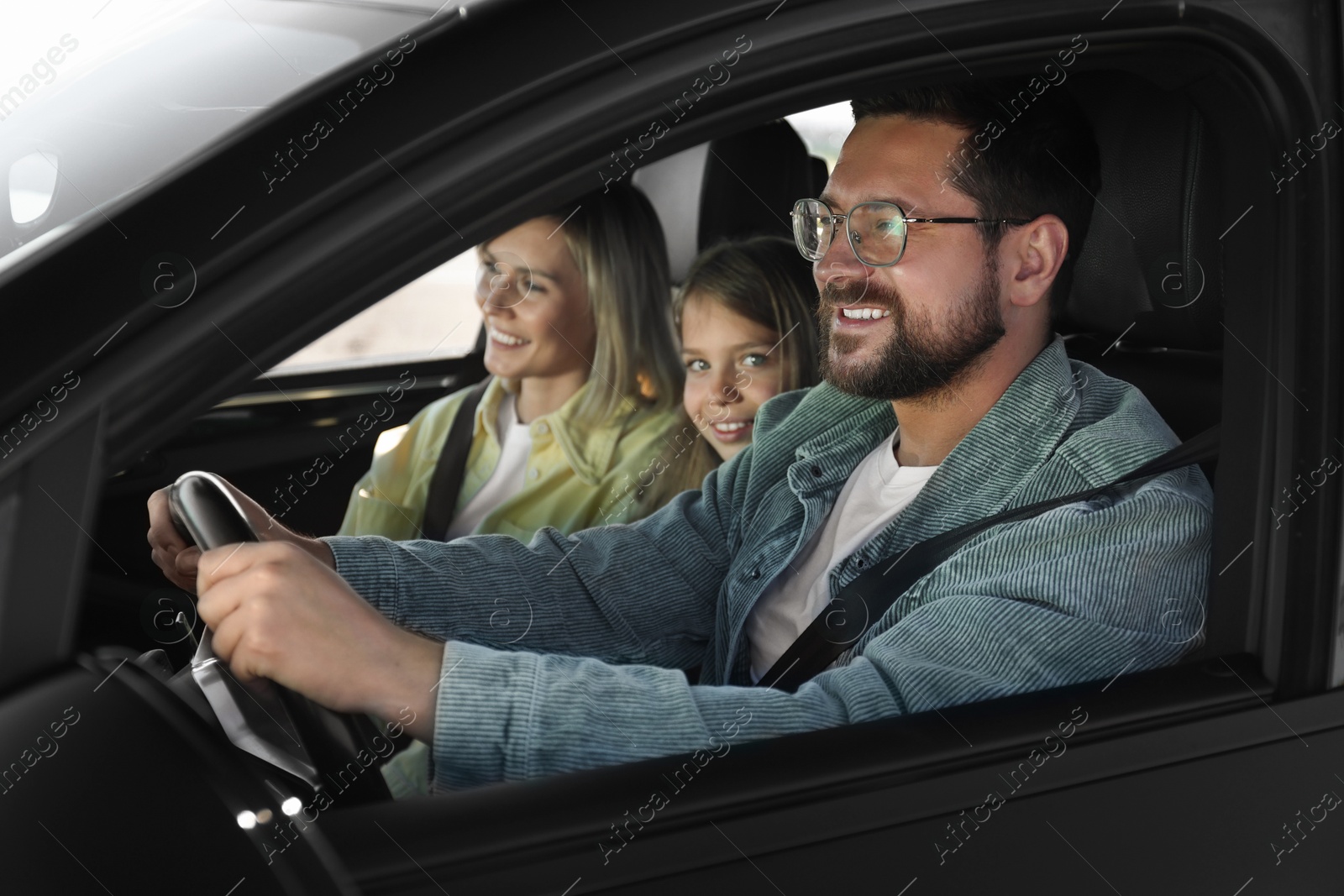 Photo of Happy family enjoying trip together by car, view from outside