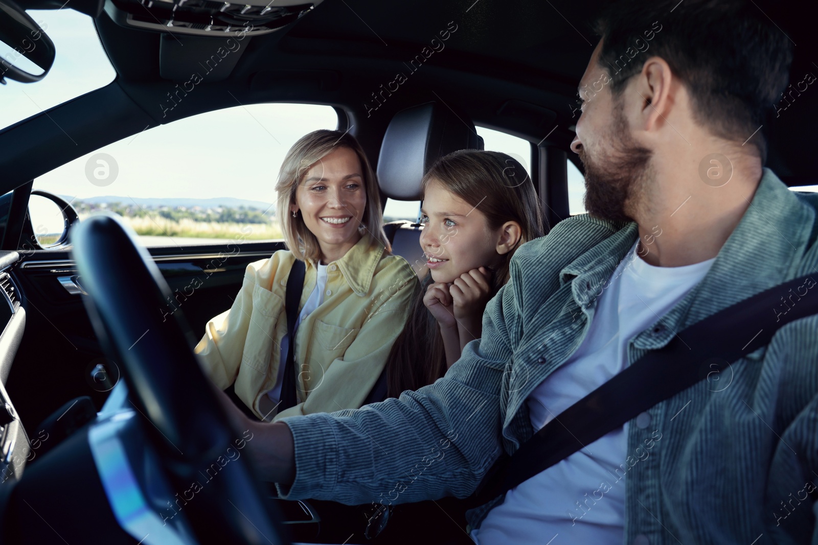 Photo of Happy family enjoying trip together by car, view from outside