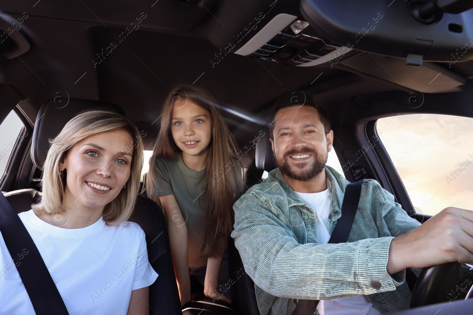 Photo of Happy family enjoying trip together by car, view from inside