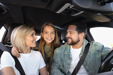 Happy family enjoying trip together by car, view from inside