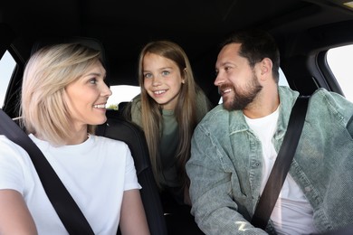 Happy family enjoying trip together by car, view from inside