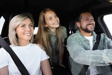 Happy family enjoying trip together by car, view from inside