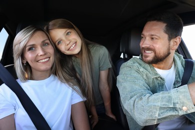 Photo of Happy family enjoying trip together by car, view from inside