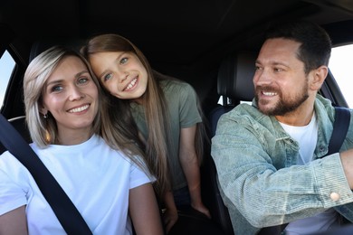 Happy family enjoying trip together by car, view from inside